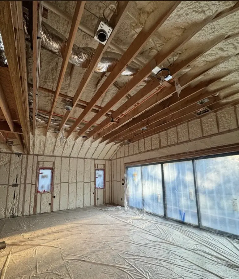 Interior walls and ceiling insulated with spray foam during new construction in Apex